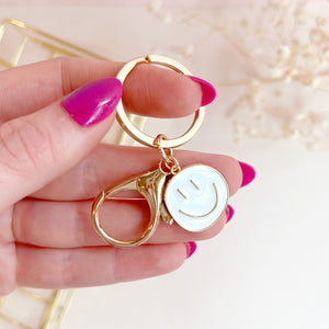 The Rosy Redhead Cute Happy Face Gold and White Enamel Keychain