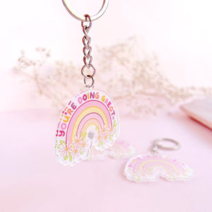 The Rosy Redhead Acrylic Keychain Rainbow Positivity