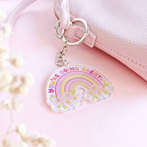 The Rosy Redhead Acrylic Keychain Rainbow Purse charm